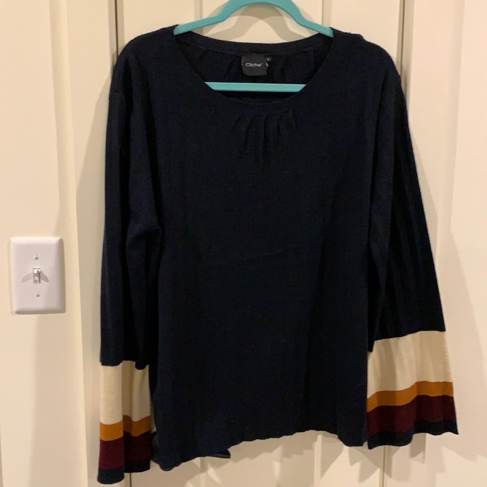 Navy pleated sweater with striped sleeves